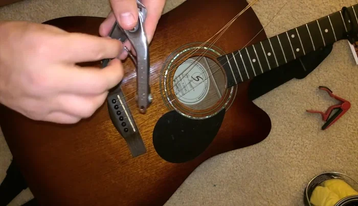 Use the JP guitar tool to remove bridge pins.