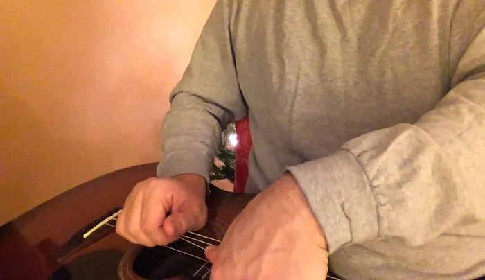 Tune the strings to pitch using an electric tuner.