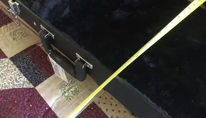 Cut out the traced shape, using a jigsaw for the main body and a belt sander (or alternative method) to shape the neck cutout.