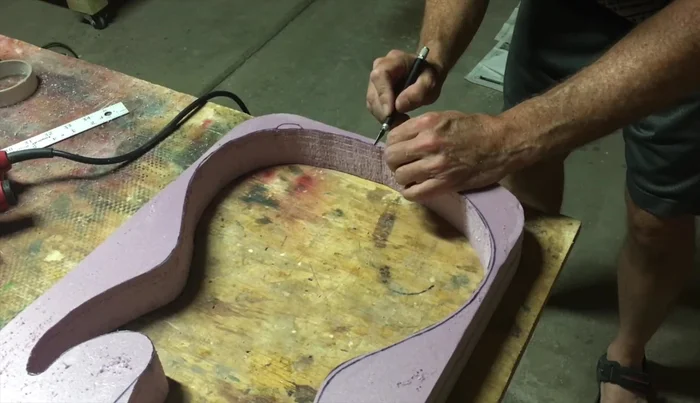 Cut out additional space for the strap and jack.