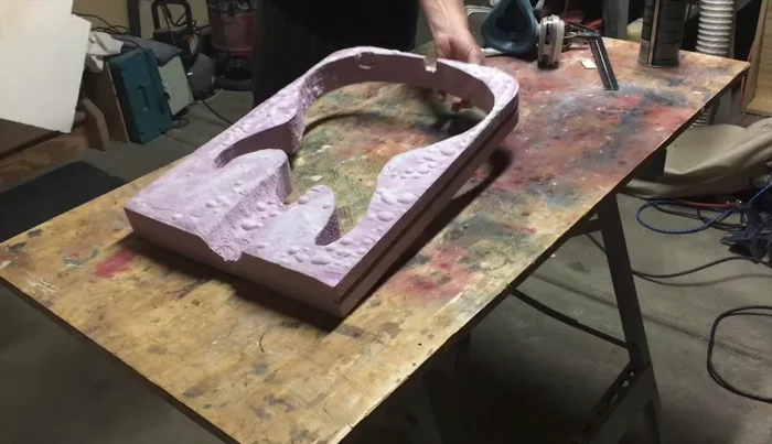 Carefully apply the faux fur, tucking it in and ensuring proper alignment.