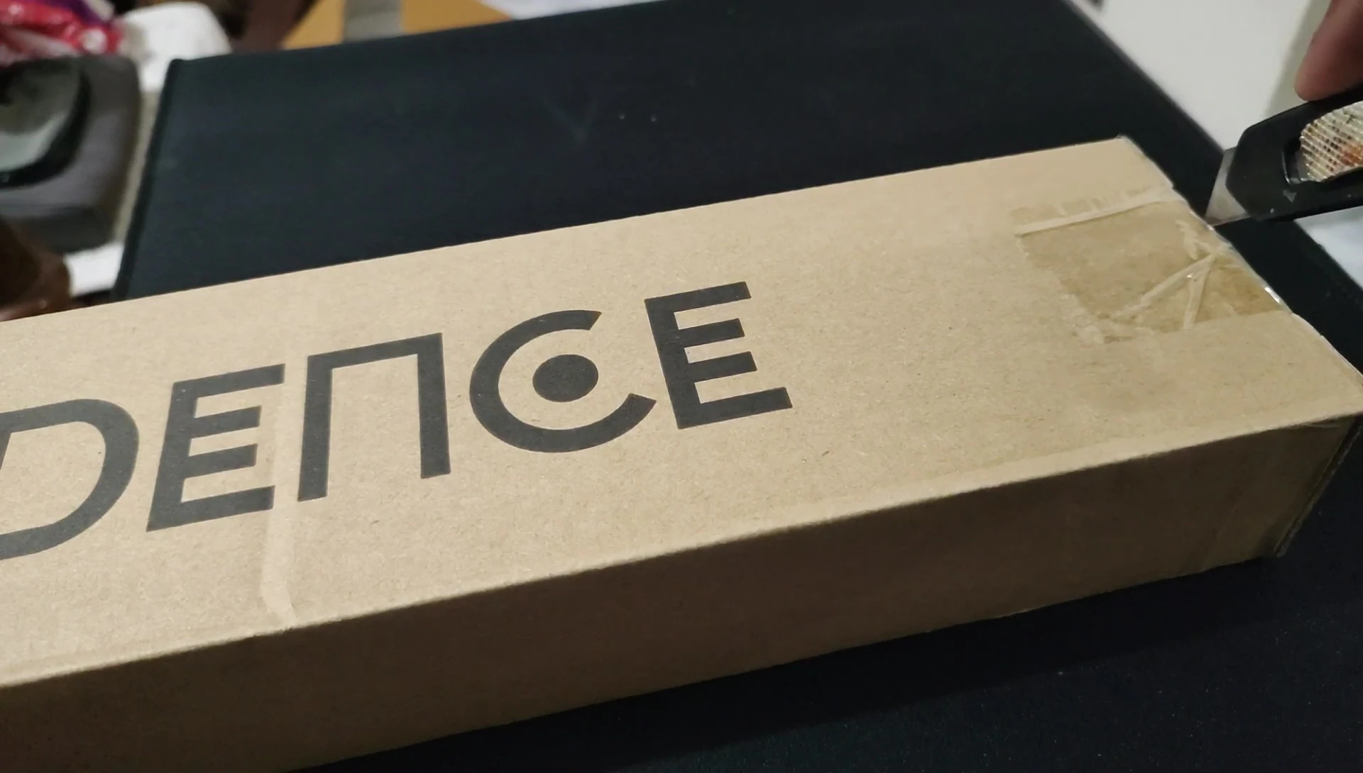 The unboxing process, showing the outer packaging.