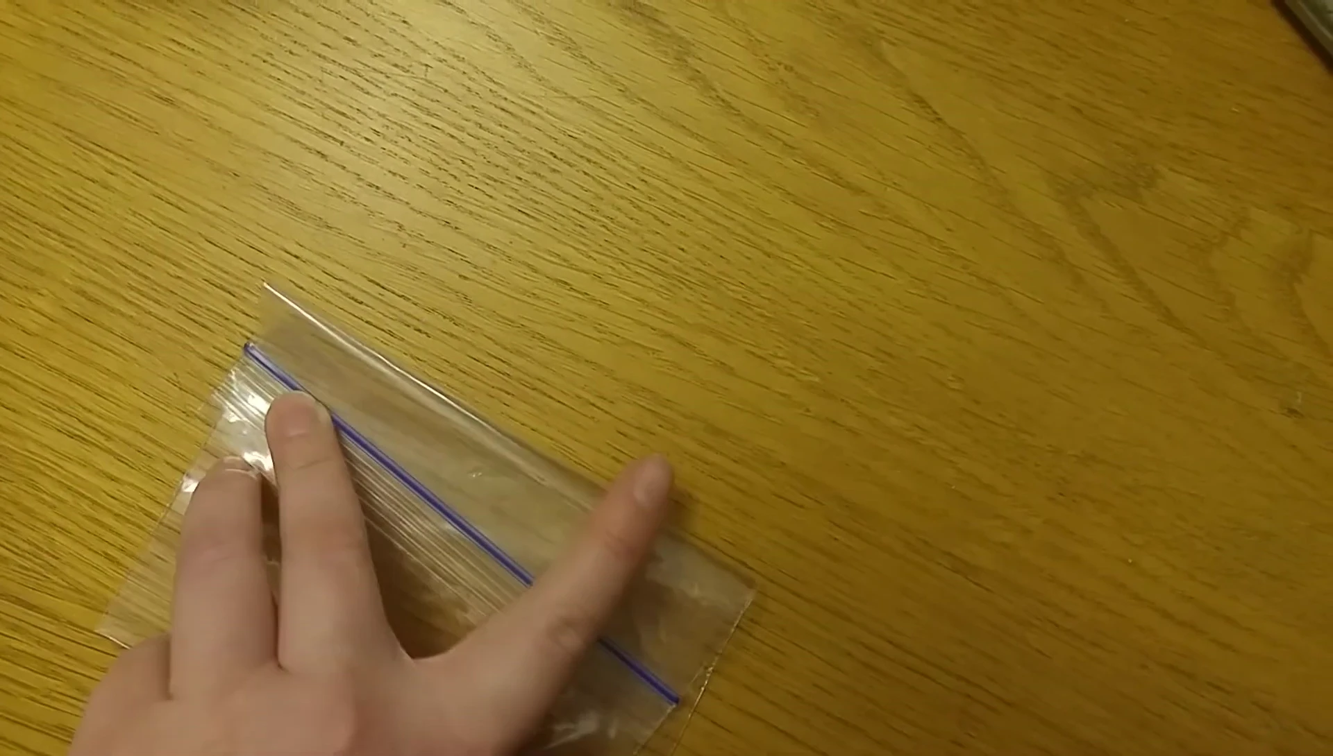 Cutting holes into the plastic bag