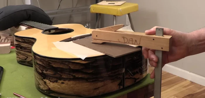 Clamp lightly using a flat callus and wax paper to keep the crack flush.