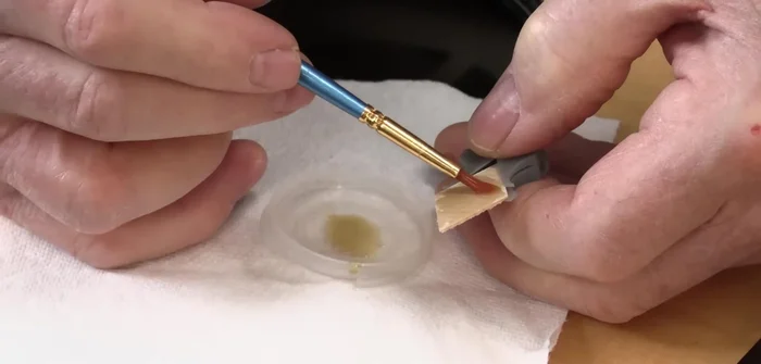 Apply glue to the cleat and insert it into the crack, ensuring proper alignment.