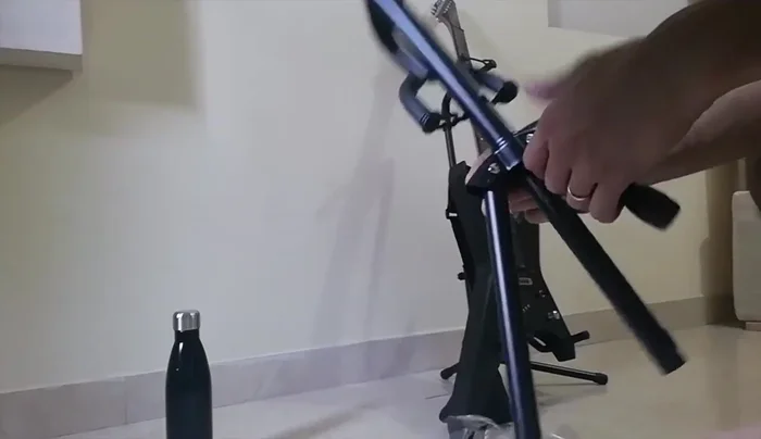 Assembling the base: Connect the three smaller stands to the main base using screws.