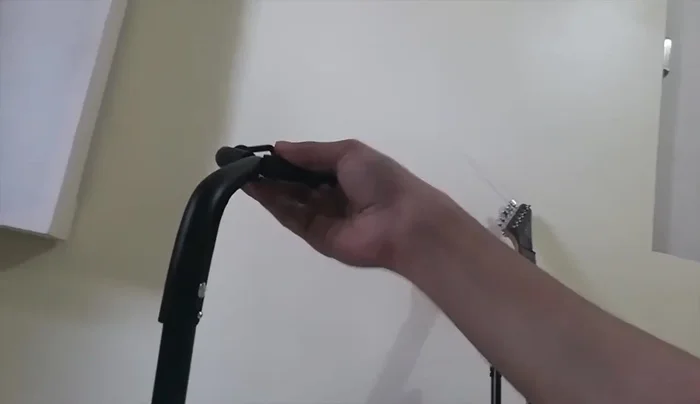 Adjusting the neck rest: Open the neck rest and adjust it to fit your guitar's neck. Secure it in place.