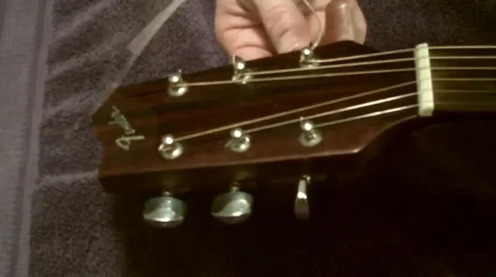 Trim excess string at the tuning peg.