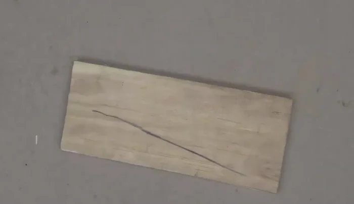 Cut out the marked shape using a saw and clamp.