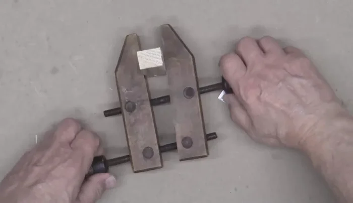 Cut out the marked shape using a saw and clamp.