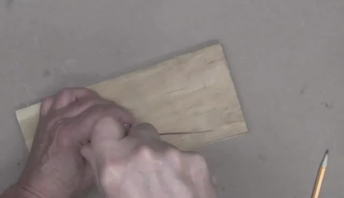 Thread the screw partially into the handle, then insert the handle into the main body and tighten the screw to secure.