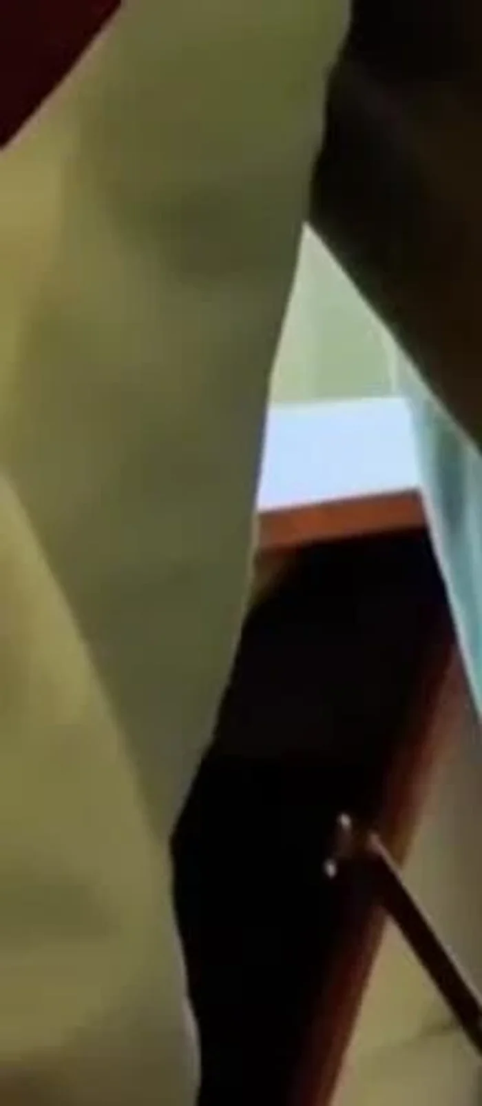 Showing how to engage the capo's locking mechanism.