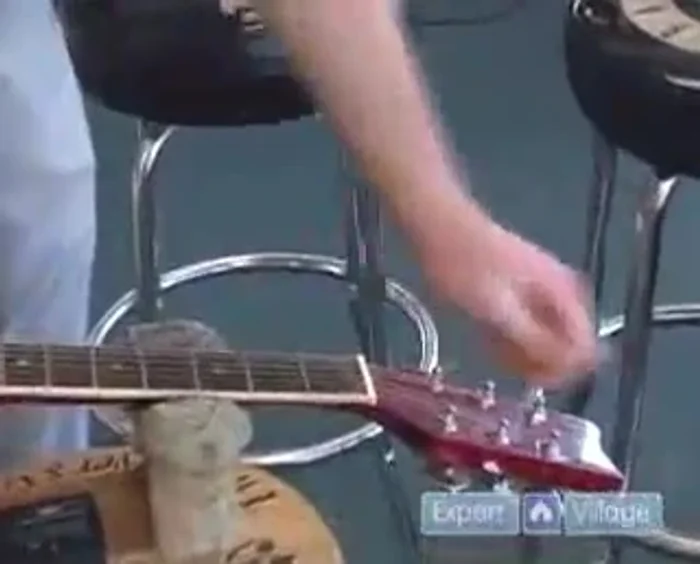 Pull the old string off the post.