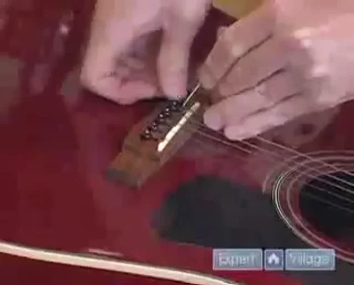 Pull the string tight and push down on the ball end to secure it.