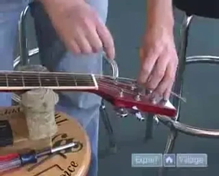 Measure and mark the extra string for the correct length.