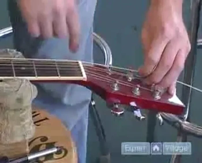 Measure and mark the extra string for the correct length.