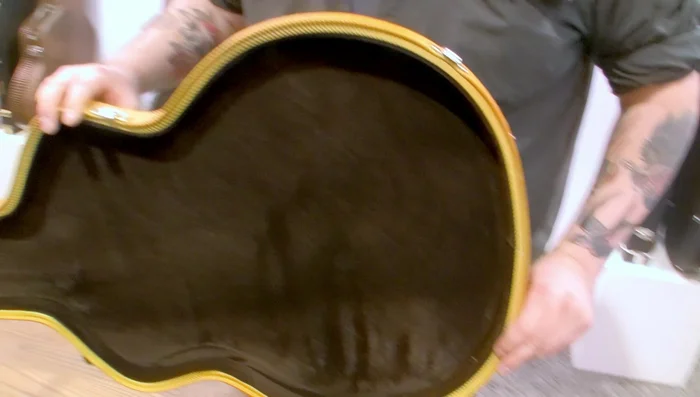 Incorporate an arch top and arch bottom with a straight headstock for a more historic look.