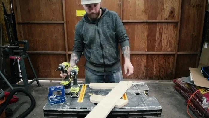 Assemble the legs and upright piece using screws.