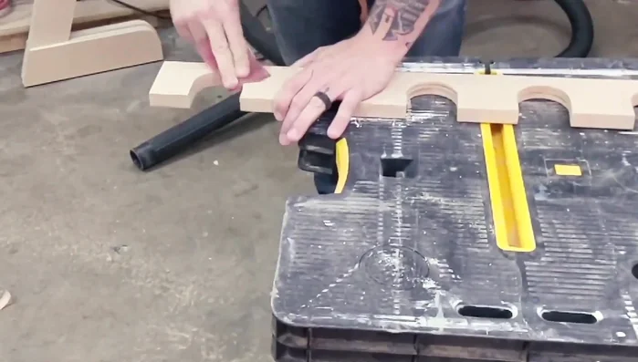 Attach the neck rest to the uprights, pre-drill, and screw them together.