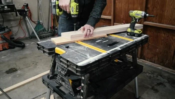 Attach the front support for the guitar bodies. Pre-drill holes and attach the body rest piece from both sides. 