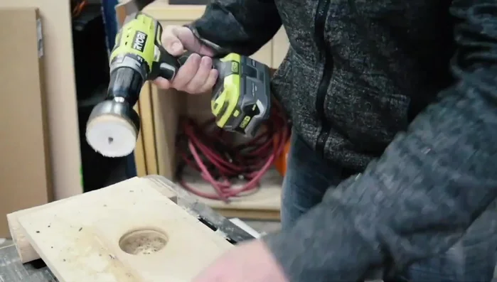 Drill holes for the neck rest using a hole saw bit.