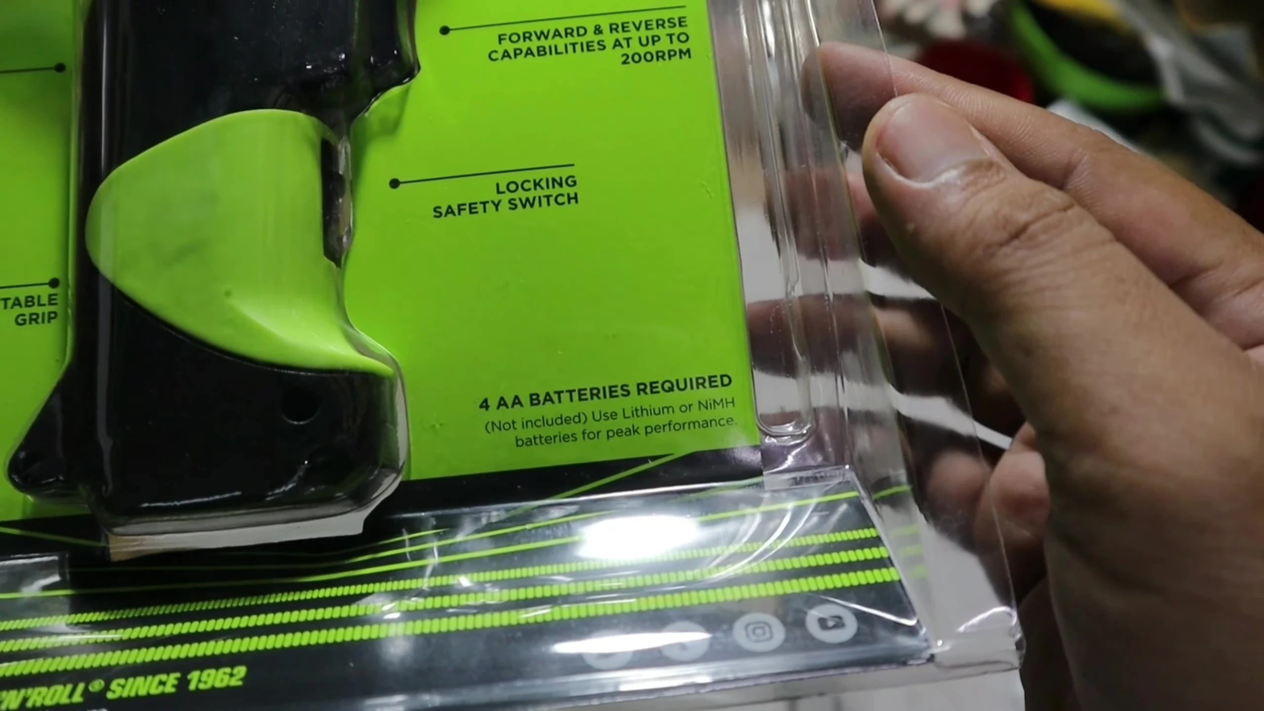 The battery compartment of the Ernie Ball Power Peg being opened.