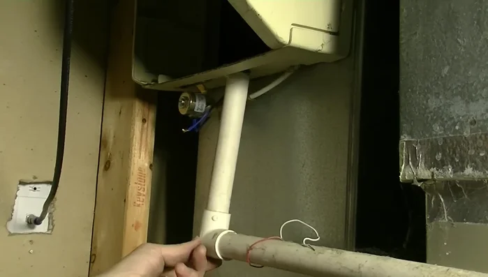 Secure the drain pipe: Find a secure and safe way to support the drain pipe, avoiding the use of electrical cords.