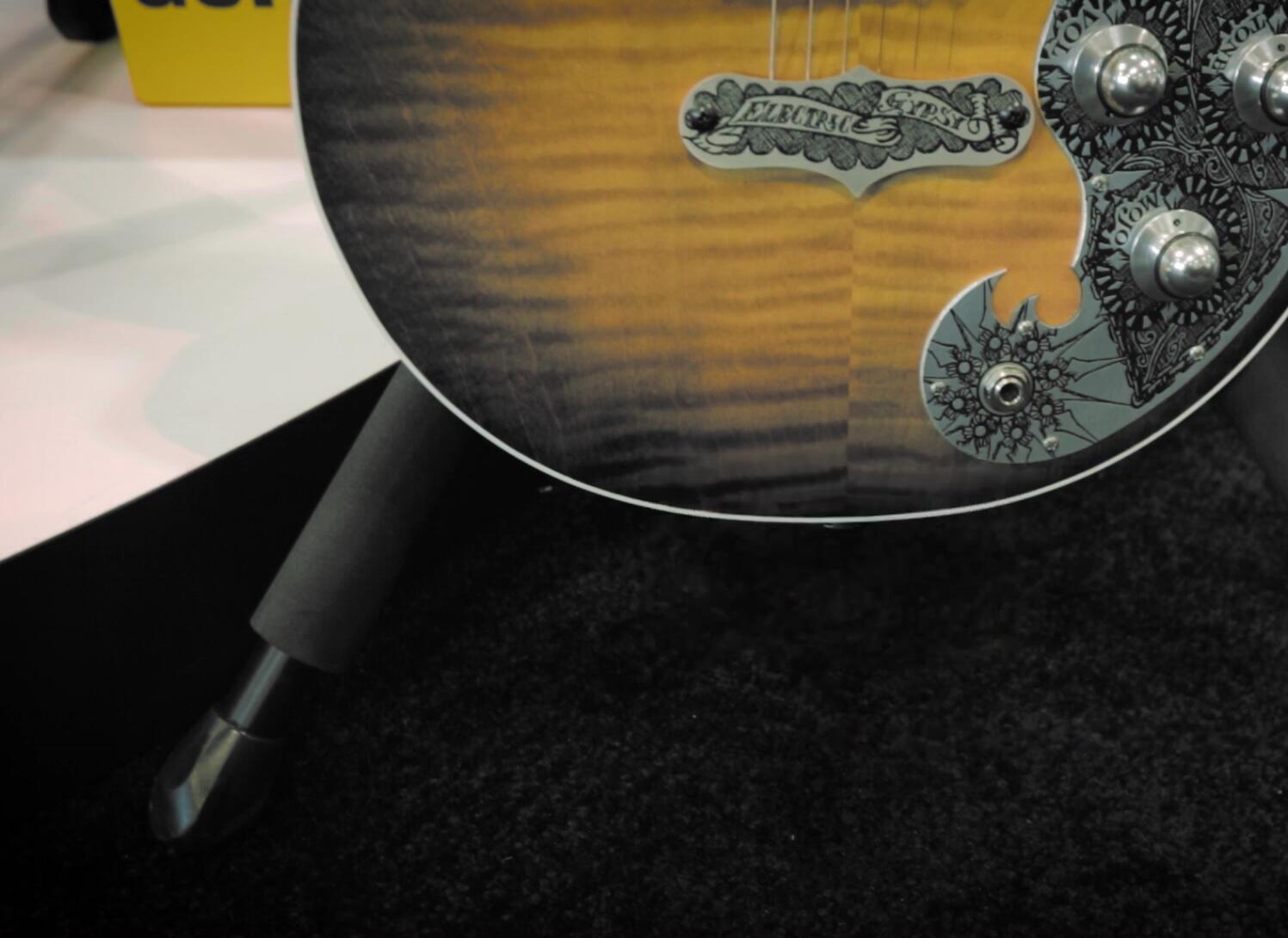 Overview shot of the improved Hercules guitar stand and wall hanger.