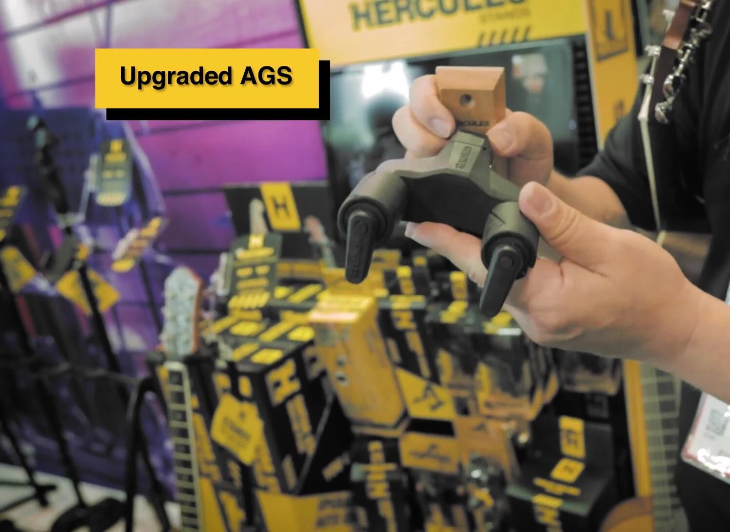 Demonstration of the wider span of the auto-grip arms, showcasing increased compatibility.