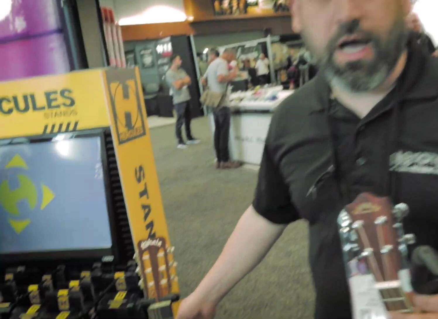 Example of a classical guitar with a wide neck being securely held by the stand.