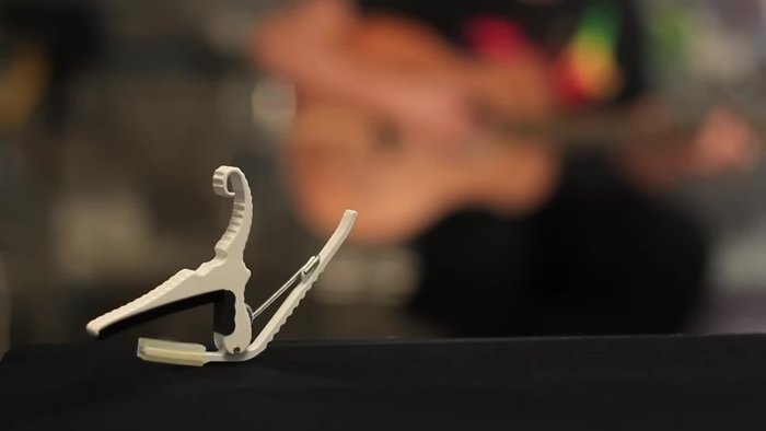 On guitars with a larger radius (like Taylor or Martin), the traditional capo applies too much pressure to the outer strings, causing tuning issues.