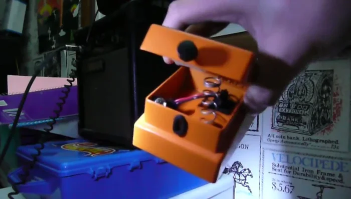 Locate the spring, switch, and battery compartment inside.