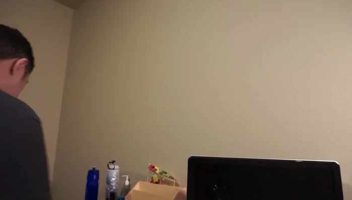 Align the backing plate with the marked holes and screw it to the wall using the provided screws. 